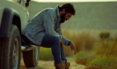 The star " Hassan Al-Raddad " revealed a new photo session for himself in the desert .