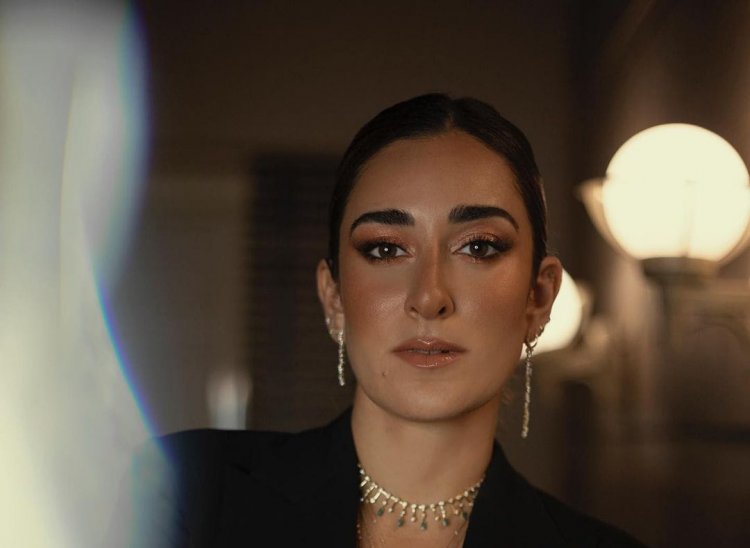 The artist " Amina Khalil " decided to break her silence and respond to the criticism leveled against her for using terms in the English language .